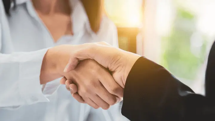 Two people shaking hands