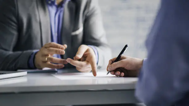 News Blog Image_Hand Pointing in Meeting_iStockphoto-1134018558