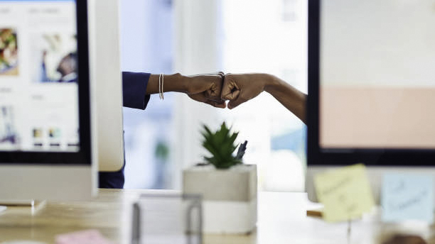 News Blog Image_Office Fist Bump_iStockphoto-1151370282