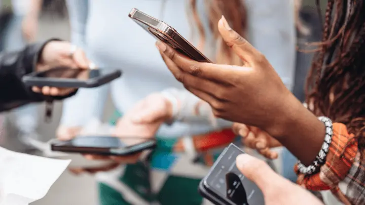 Group of People Holding Phones