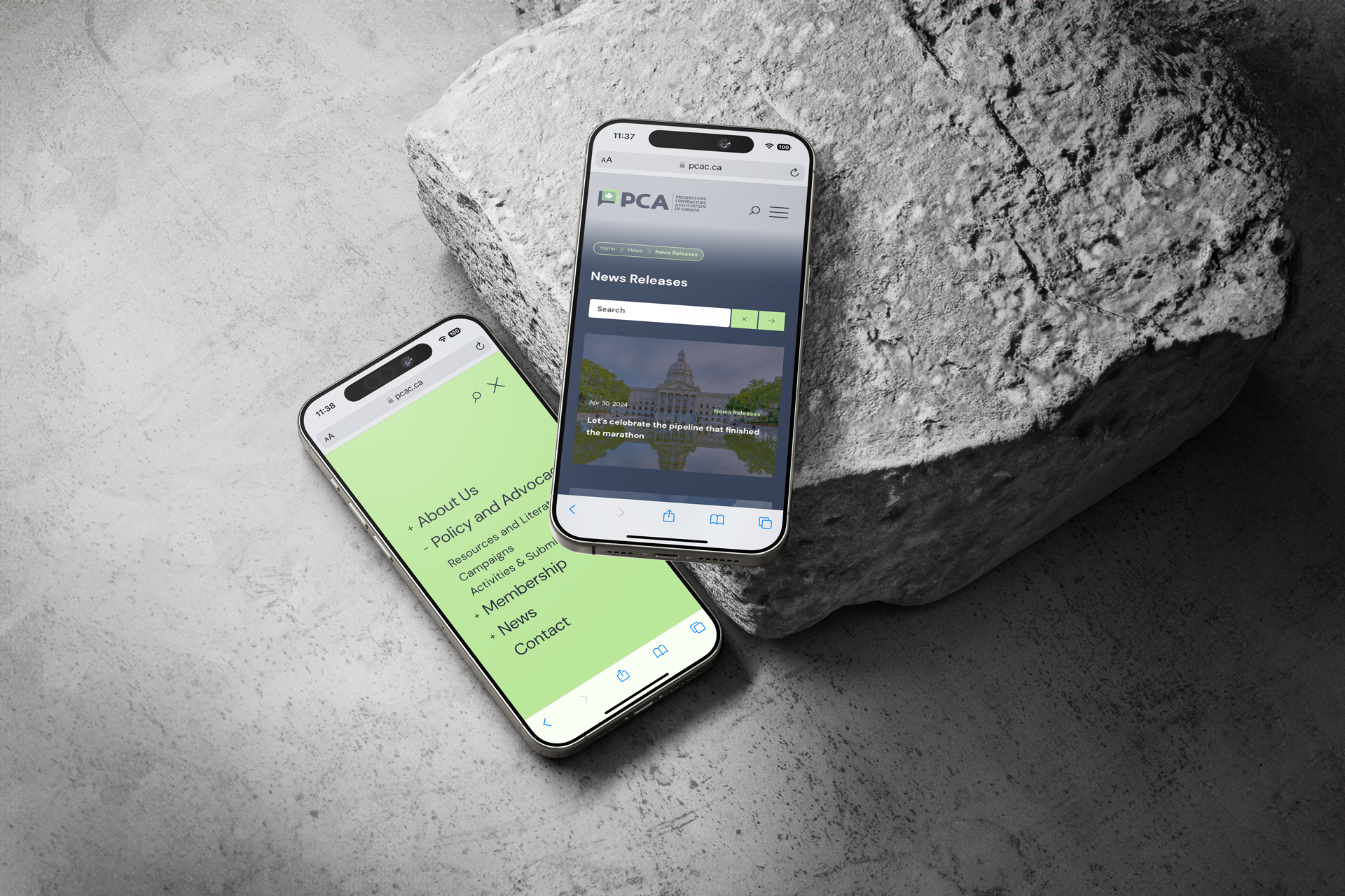 Two smartphones showing PCA's website, one smartphone is on a rock, the other is on the ground.